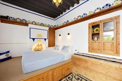 a bedroom with a bed and a window at Villa Annoula - Traditional Lindian House in Líndos
