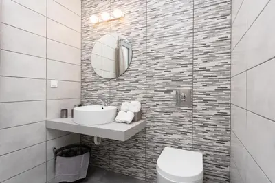 a white bathroom with a sink and a mirror at Villa Livis 2 in Kiotari