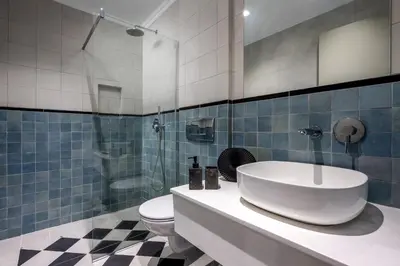 a bathroom with a sink and a toilet at Alegrand Suites in Rhodes Town
