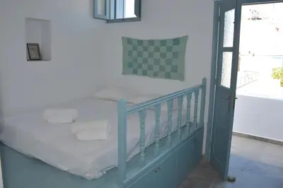 a bedroom with a bed and a window at Villa Polixeni Gennadi in Gennadi