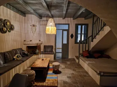 a living room with a couch and a table at Villa Polixeni Gennadi in Gennadi