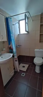 a bathroom with a toilet and a sink at North Bay Apartments in Rhodes Town