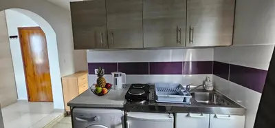 a kitchen with a sink and a counter top at North Bay Apartments in Rhodes Town