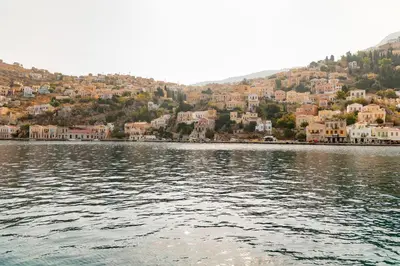 a large body of water with houses on a hill at Kantirimi House - A1 in Symi