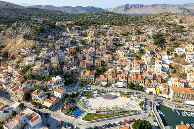 an aerial view of a town on a hill at Townhall Apartment in Symi