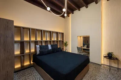 a bedroom with a large bed in a room at Townhall Apartment in Symi