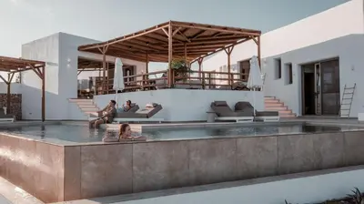 a house with a swimming pool with people in it at CasaCarma V, privates XL-Pool, Boho-Design in Lachania