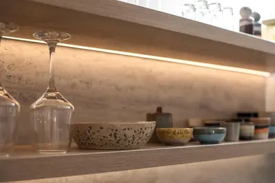 a shelf with a wine glass and bowls on it at CasaCarma V, privates XL-Pool, Boho-Design in Lachania