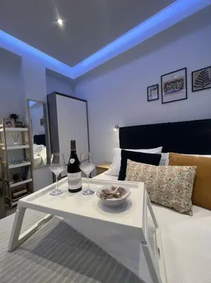 a room with a white table with two wine glasses at Ikarus Rhodes Center in Rhodes Town