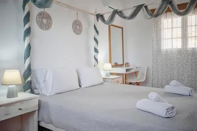 a bedroom with a bed with towels on it at Nikolas Apartment in Pefki Rhodes