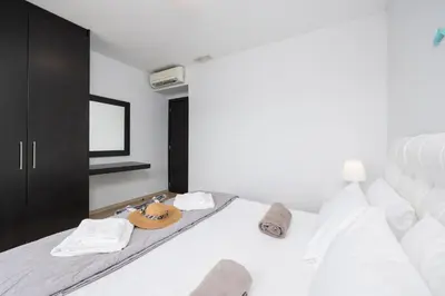 a bedroom with a bed with a hat on it at Villa Ira in Lachania