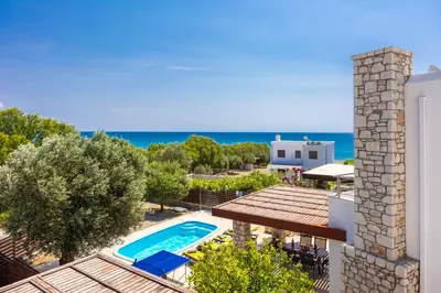 an external view of a villa with a swimming pool at Villa Ira in Lachania