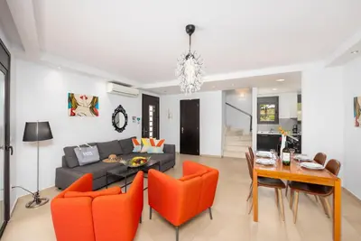a living room with a couch and a table at Villa Ira in Lachania