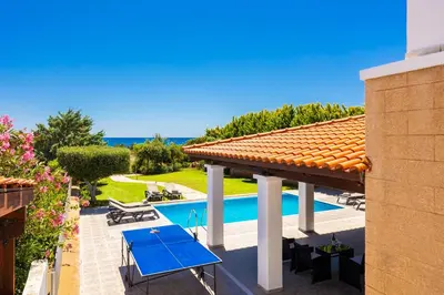 a view of a house with a swimming pool at Villa Mediterranean Blue in Yennadhion