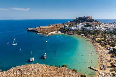 an aerial view of a beach with boats in the water at Villa Metis in Lachania