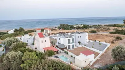 an aerial view of a house near the ocean at Villa Verona Pool in Lachania