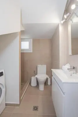a bathroom with a toilet and a sink at Casa Elia Filerimos in Pastida