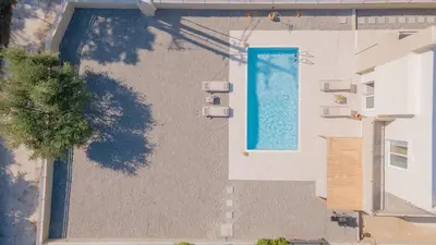 an overhead view of a swimming pool on the side of a building at Casa Elia Filerimos in Pastida