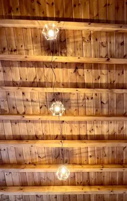 a ceiling of a room with lights on it at Pavlos House in Symi