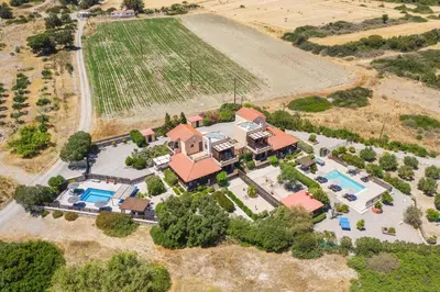 an aerial view of a house with a pool and a yard at Villa Alnika Azalea by Villa Plus in Lachania