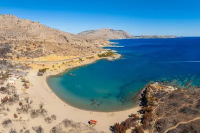 an aerial view of a beach with blue water at Amphitrite Villa in Gennadi
