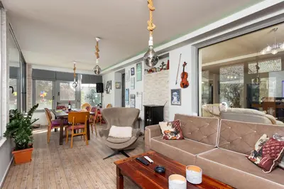 a living room with a couch and a table at Villa Ammos in Afantou