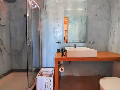 a bathroom with a sink and a shower at St. George Studios in Rhodes Town