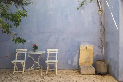 two chairs and a table and a table and two chairs at St. George Studios in Rhodes Town