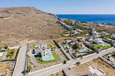 an aerial view of a resort with the ocean at Villa Angelika Lindos by Villa Plus in Pefki Rhodes