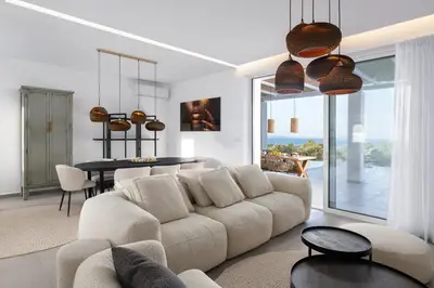 a living room with a couch and a table at Sunset Hill Villa Rhodes in Gennadi