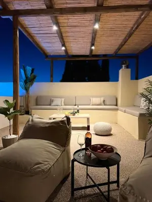 a living room with a couch and a table at Antheia Traditional House in Archangelos