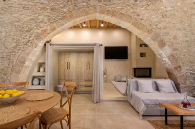 a living room with a couch and a table at Antheia Traditional House in Archangelos