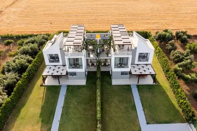 an aerial view of a house in a field at Filoxenia Villas in Gennadi