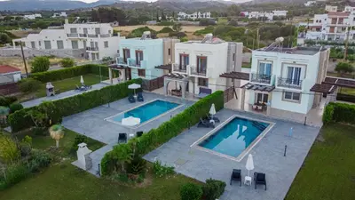 an aerial view of a house with a swimming pool at Petra Villas in Gennadi