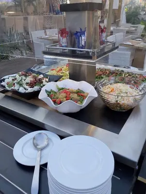 a buffet line with many different types of food at Alia Suites and Spa in Haraki