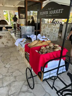 a food cart with bread on it in a store at Alia Suites and Spa in Haraki