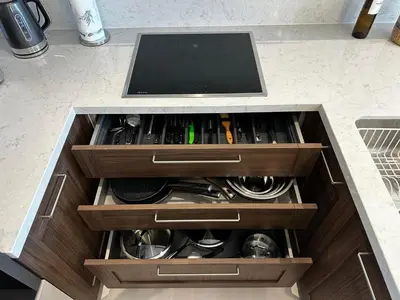 a drawer with a tv on top of a counter at Samanthas LUXURY APARTMENT in Haraki