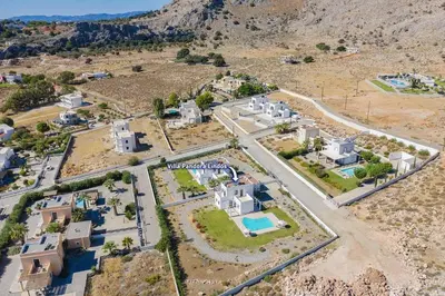 an aerial view of a village in the mountains at Villa Pandora Lindos by Villa Plus in Líndos