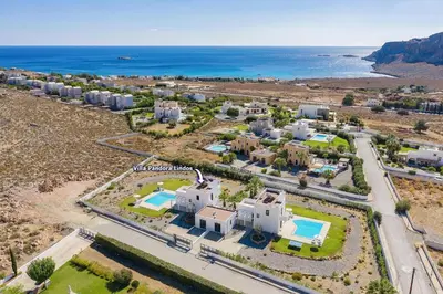 an aerial view of a resort with the ocean at Villa Pandora Lindos by Villa Plus in Líndos