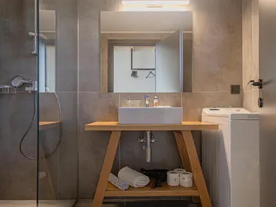 a bathroom with a sink and a shower at Haraki Luxury Villas in Haraki