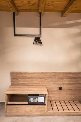 a stage with a clock in a room at Haraki Luxury Villas in Haraki