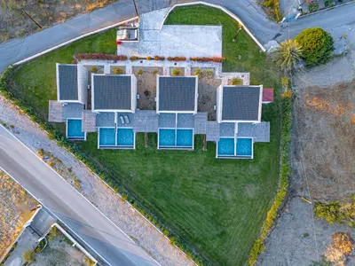 an overhead view of a house with solar panels on the lawn at Haraki Luxury Villas in Haraki