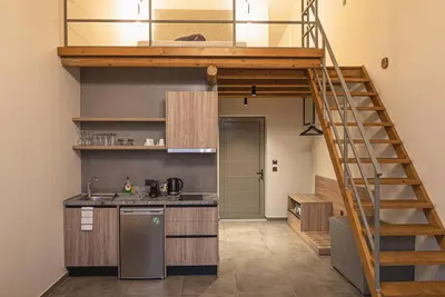 a kitchen with a loft bed in a room at Haraki Luxury Villas in Haraki