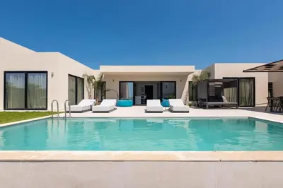 a swimming pool in the backyard of a house at Trapezia Luxury Living in Kolimbia