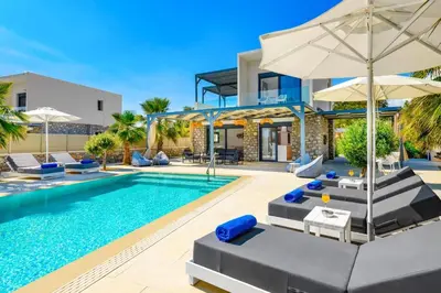 an image of a villa with a swimming pool at Villa Apollon Lindian Palm by Villa Plus in Kiotari