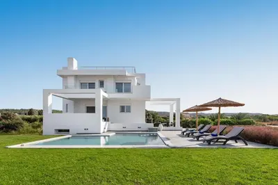 a villa with a swimming pool and a house at Villa Katerina - Soroni in Rhodes Town
