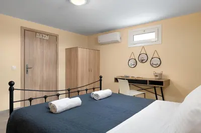 a bedroom with a bed with two towels on it at Villa Katerina - Soroni in Rhodes Town