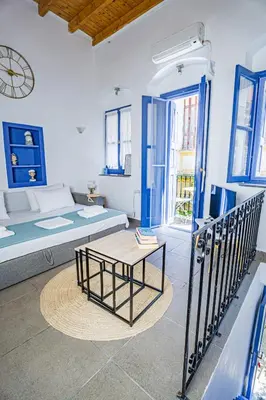 a living room with a couch and a table at Kali Strata 2 - Downtown in Symi
