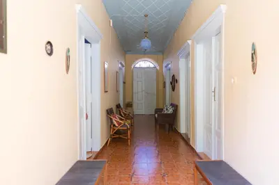a hallway with a tile floor and a ceiling at Villa Pavlos in Symi
