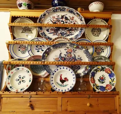 a bunch of plates and bowls on a shelf at Nadia's House 1 in Afantou